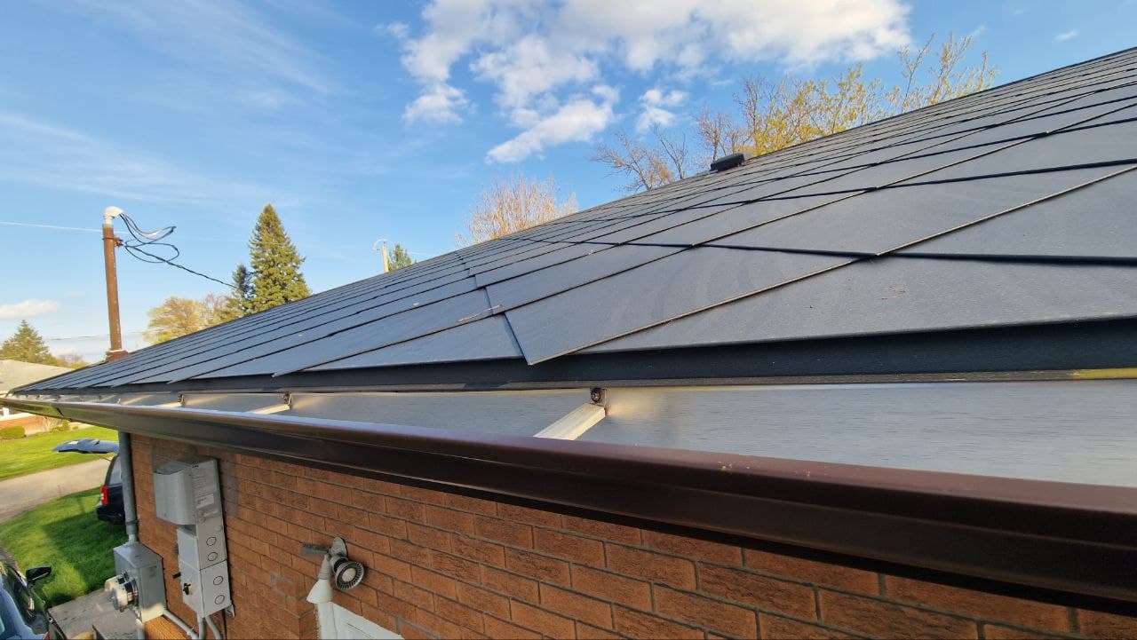 Completed professional asphalt shingle roofing by Compass Roofing